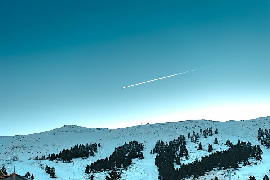 mountains and green trees under blue sky during daytime, green trees and snow capped field under blue sky during daytime HD wallpaper