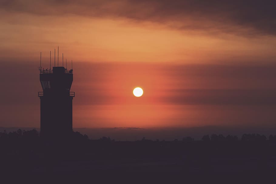 silhouette of tower during golden hours, silhouette photography of tower during sunset HD wallpaper