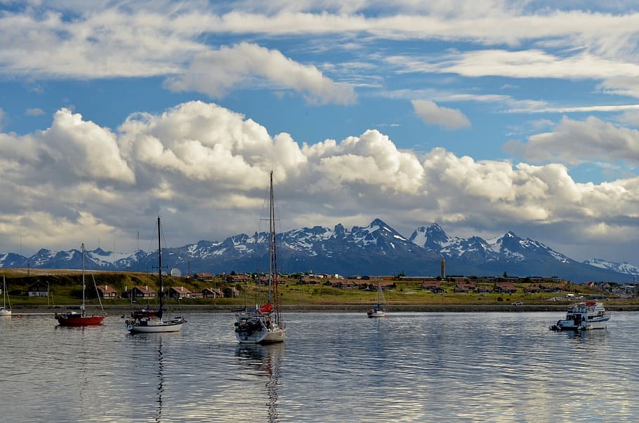 boat over water under white clouds at daytime, Ushuaia, Lakes HD wallpaper