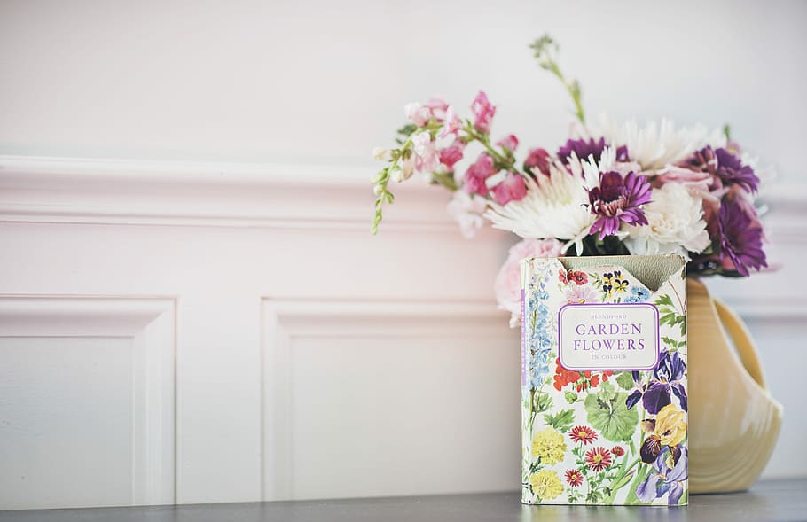 Garden Flowers book beside flower arrangement in vase, photo of Garden Flowers box near bouquet of flowers HD wallpaper