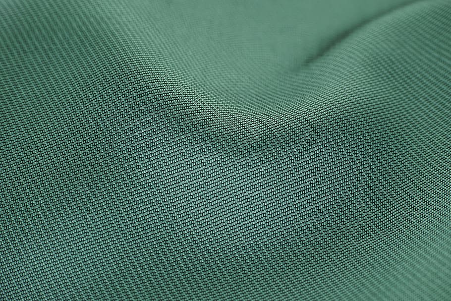 green textile, fabric, color image, copy space, detail, macro