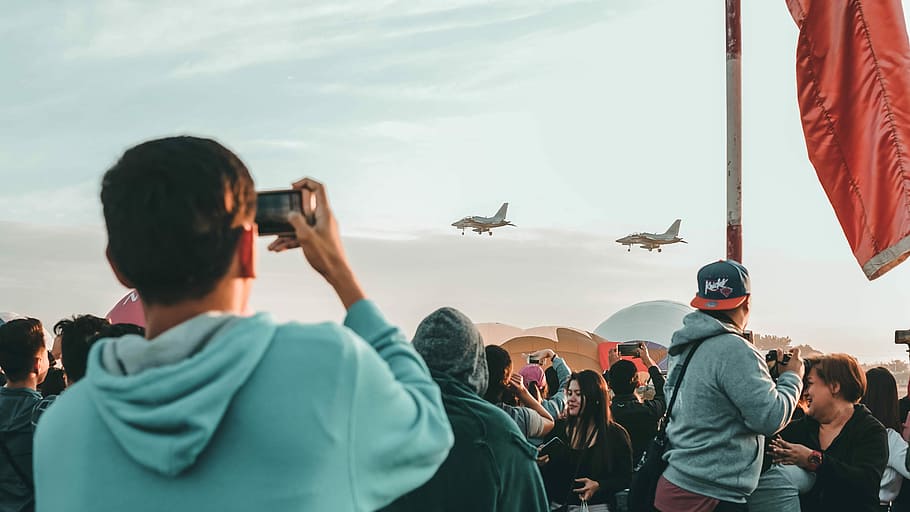 man holding camera point on planes, man taking photo of two fighter planes HD wallpaper