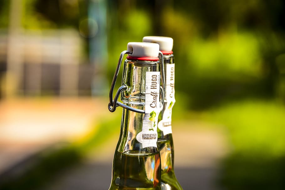 Selective Focus Photography of Two Clear Air Tight Bottles, alcohol HD wallpaper