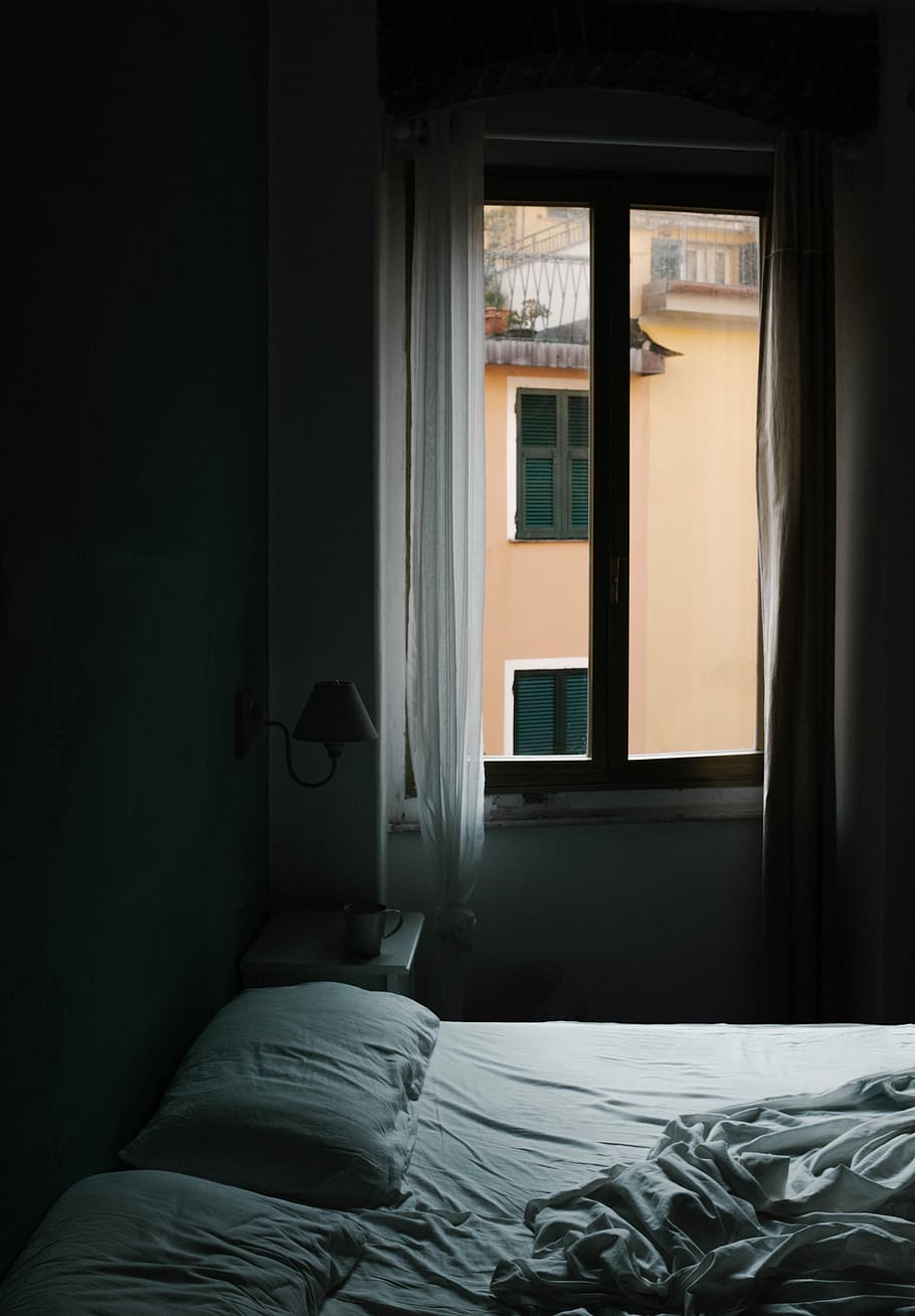 Download A Room With A Bed And A Window Wallpaper