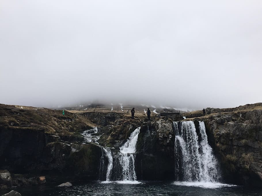 time lapse photography of waterfalls, silhouette photo of person standing on waterfalls during daytime HD wallpaper
