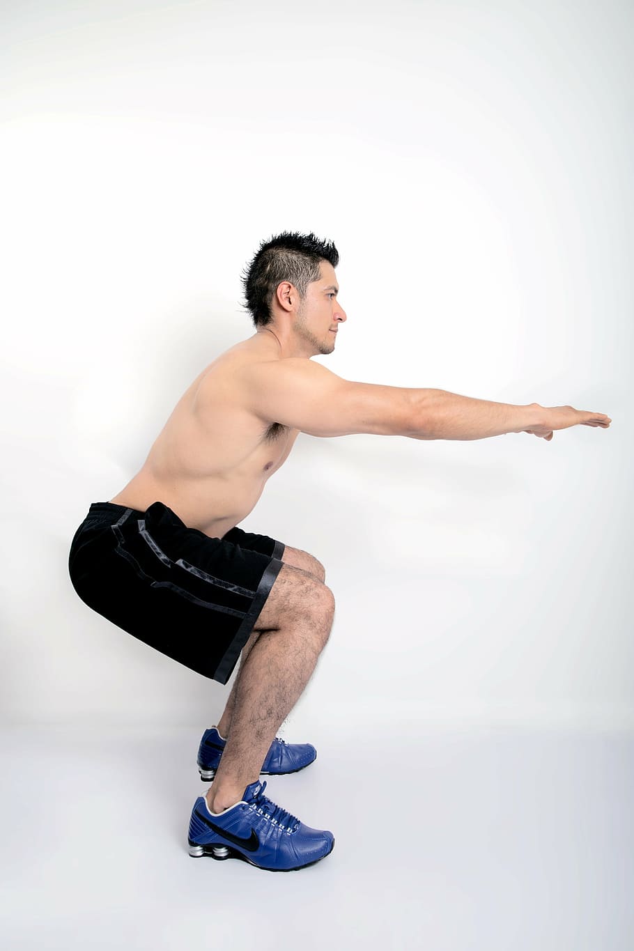 man in black shorts doing exercise trick, fitness, model, shirtless