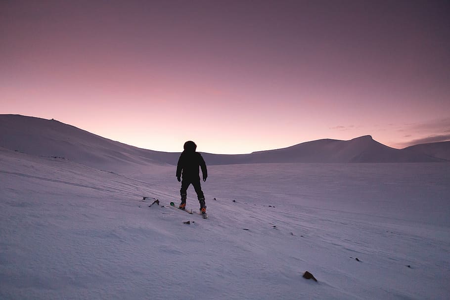 person climbing on on the of the snowy mountain, sunset, hiking HD wallpaper