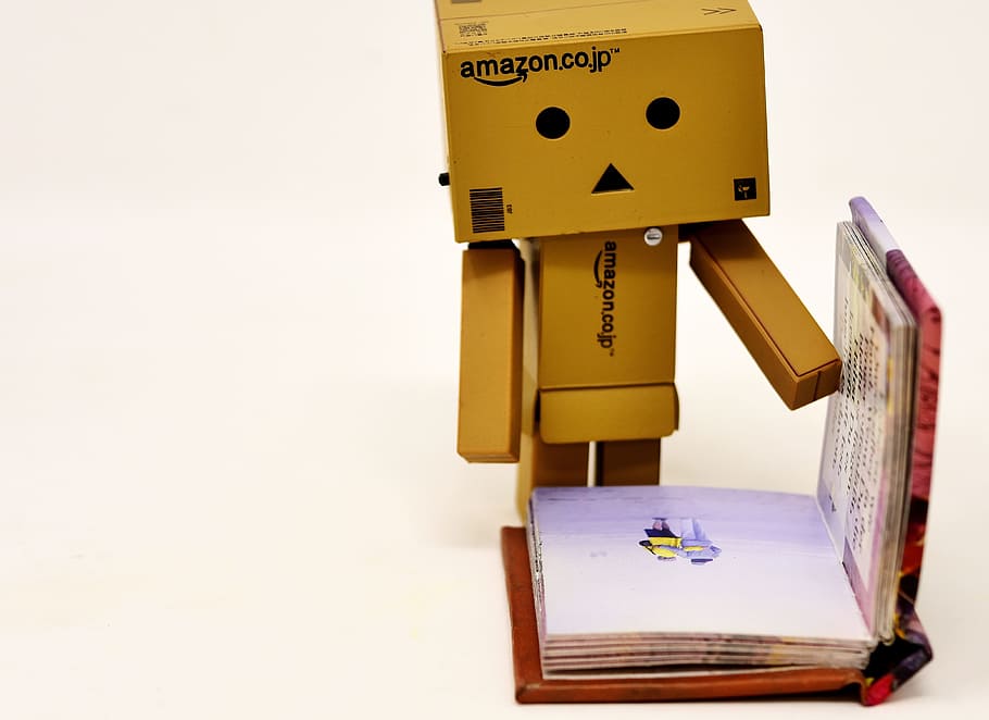 box man opening book, read, danbo, figure, funny, cute, book pages HD wallpaper
