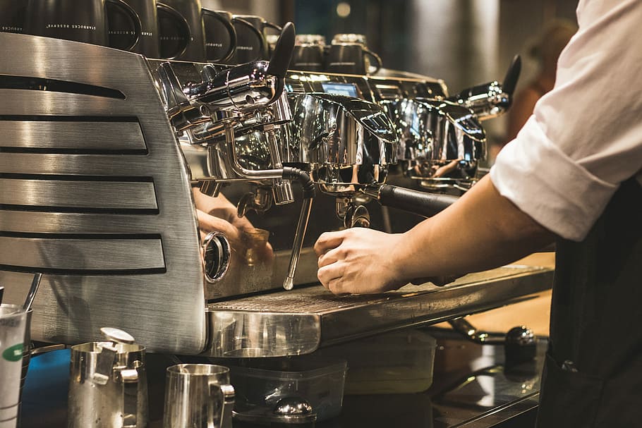person using espresso machine, person holing cup on dispenser HD wallpaper