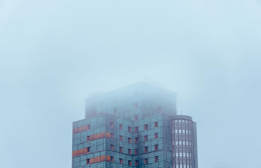photo of white and blue building covered with clouds, building with fog during daytime HD wallpaper
