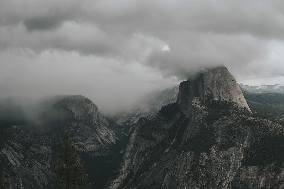 aerial view photography of mountain under clouds, aerial view photography of mountain under cloudy sky HD wallpaper