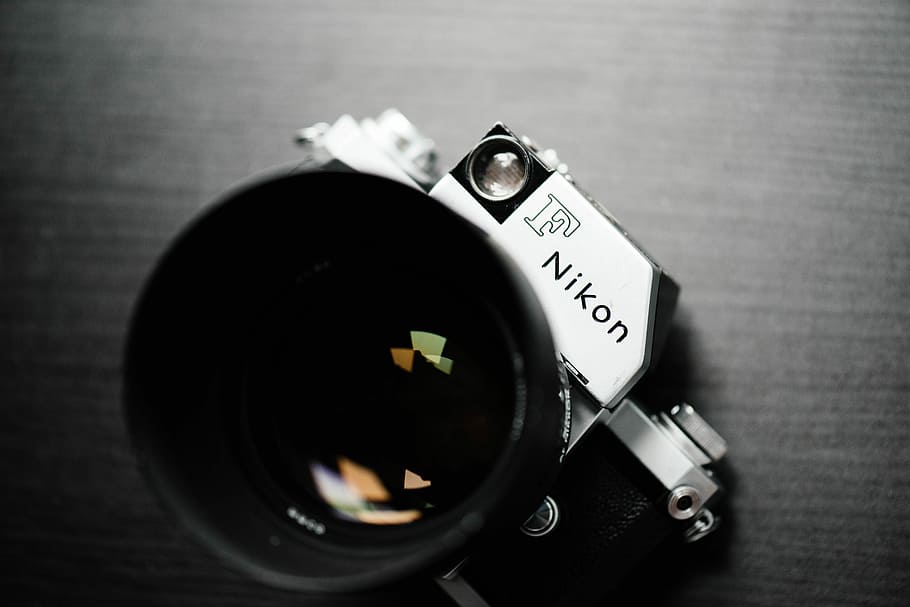 gray and black Nikon DSLR camera, black and white Nikon F camera