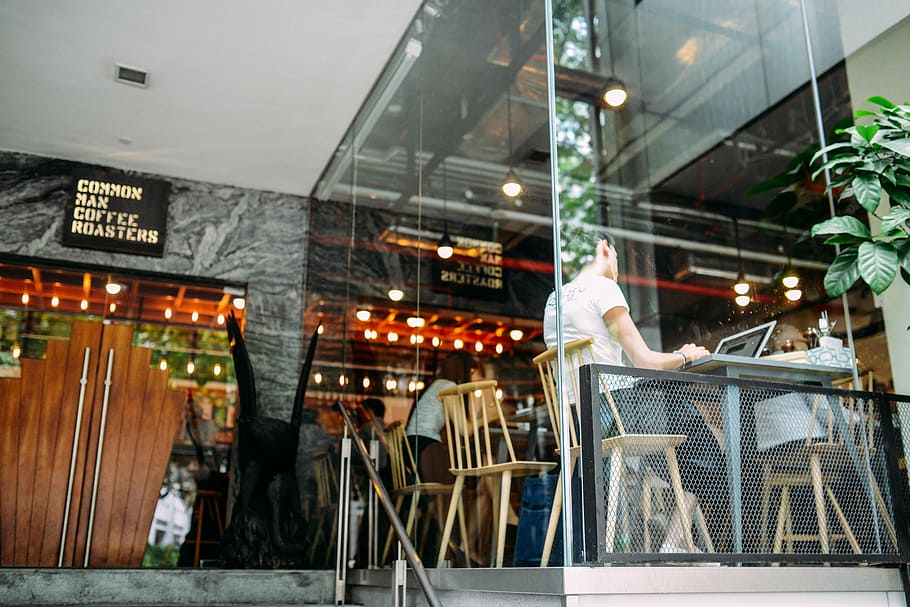 person sitting in front of table using laptop computer, restaurant HD wallpaper