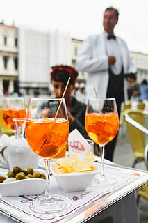 Aperol Spritz is a cocktail consisting of prosecco, aperitif and soda water HD wallpaper