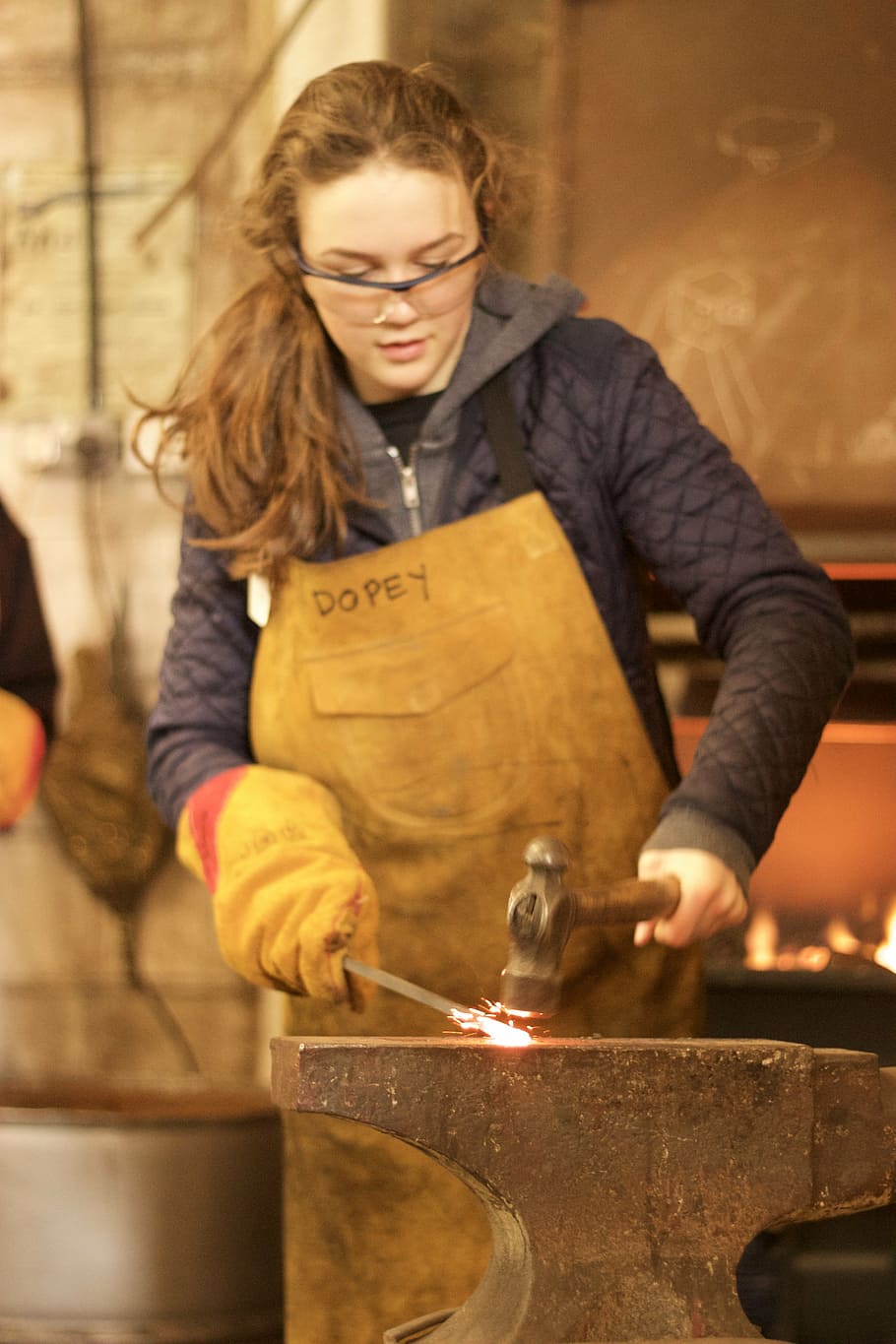 woman hitting metal with hammer, iron, anvil, blacksmith, steel