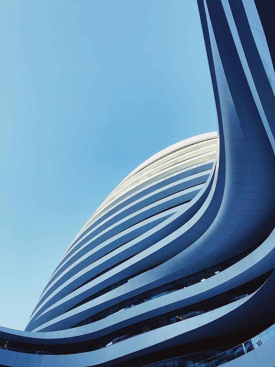 low-angle photography of state of the high-rise building under blue calm sky, low angle view of high-rise building HD wallpaper