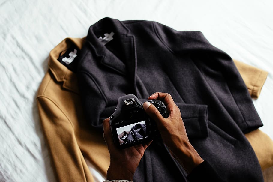 person using black DSLR camera, clothing, brown, jacket, coat HD wallpaper