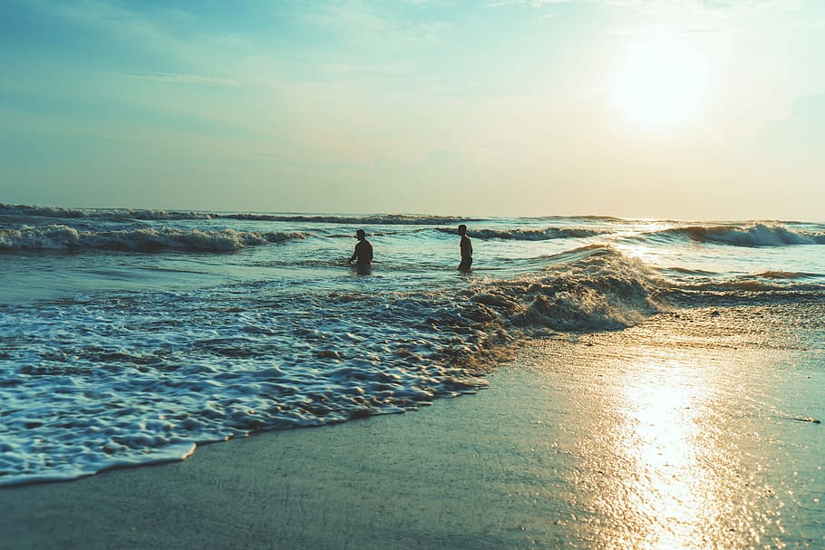 beach during daytime, two person standing on sea, ocean, wave HD wallpaper