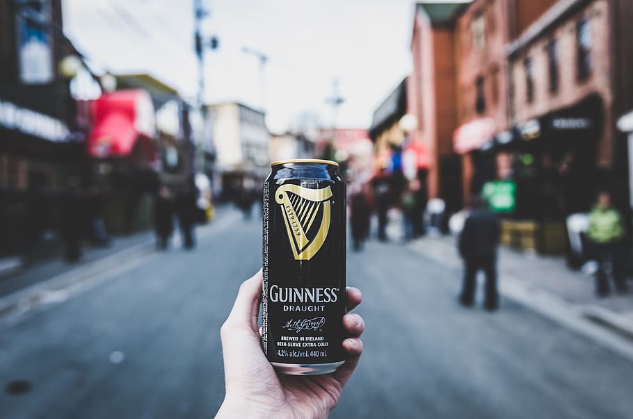 person holding Guinness can, person holding Guinness beer can HD wallpaper
