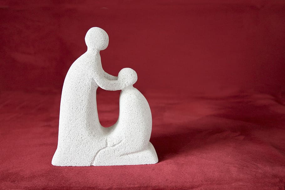 standing human and kneeling human figurine on red textile, blessing HD wallpaper