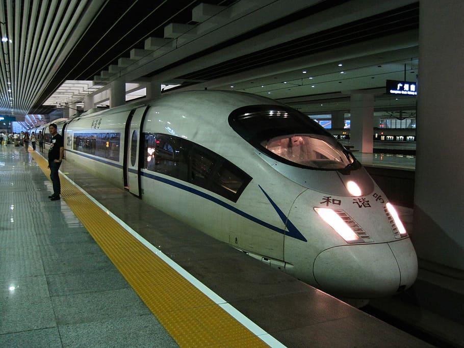 person standing near a bullet train, high speed train, hexie HD wallpaper