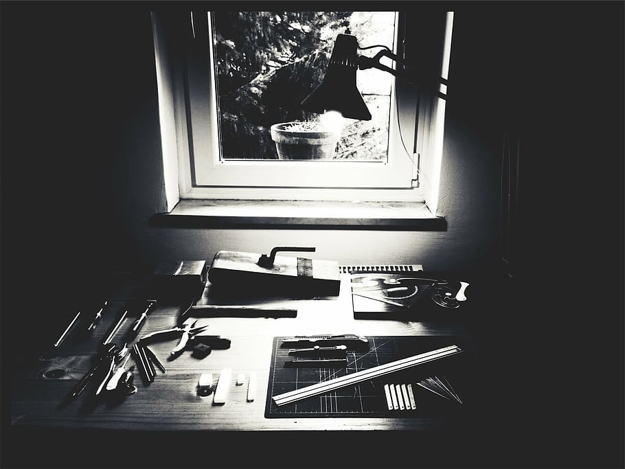 grayscale photo of table with assorted tools near window, hand HD wallpaper