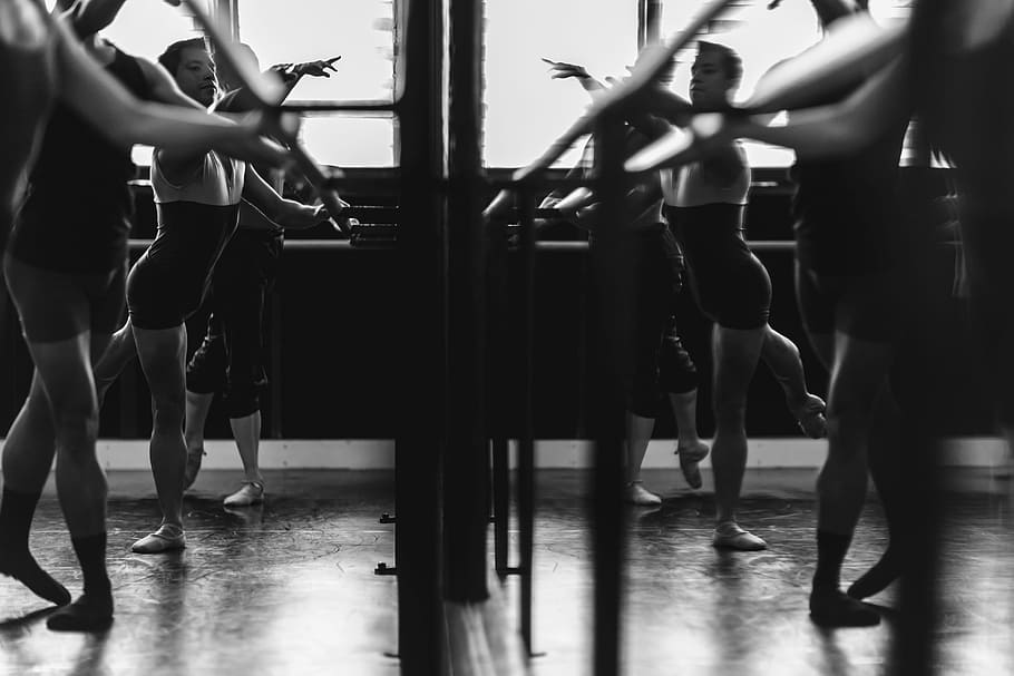 grayscale photo of womens exercising in front of mirror, group of women dancing ballet