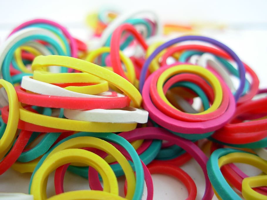 macro shot photography of rubberbands, rubber bands, colors, elastic