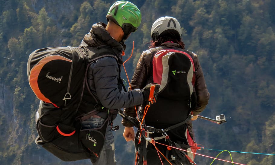 two person wearing assorted-color backpacks, paragliding, longing HD wallpaper
