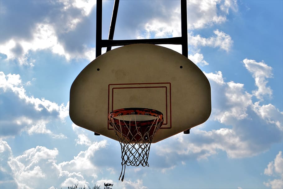 white and black basketball hoop under bue sky at daytime, backboard