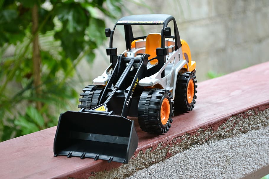 toy, plastic, dozer, backhoe, close-up, wheels, construction HD wallpaper