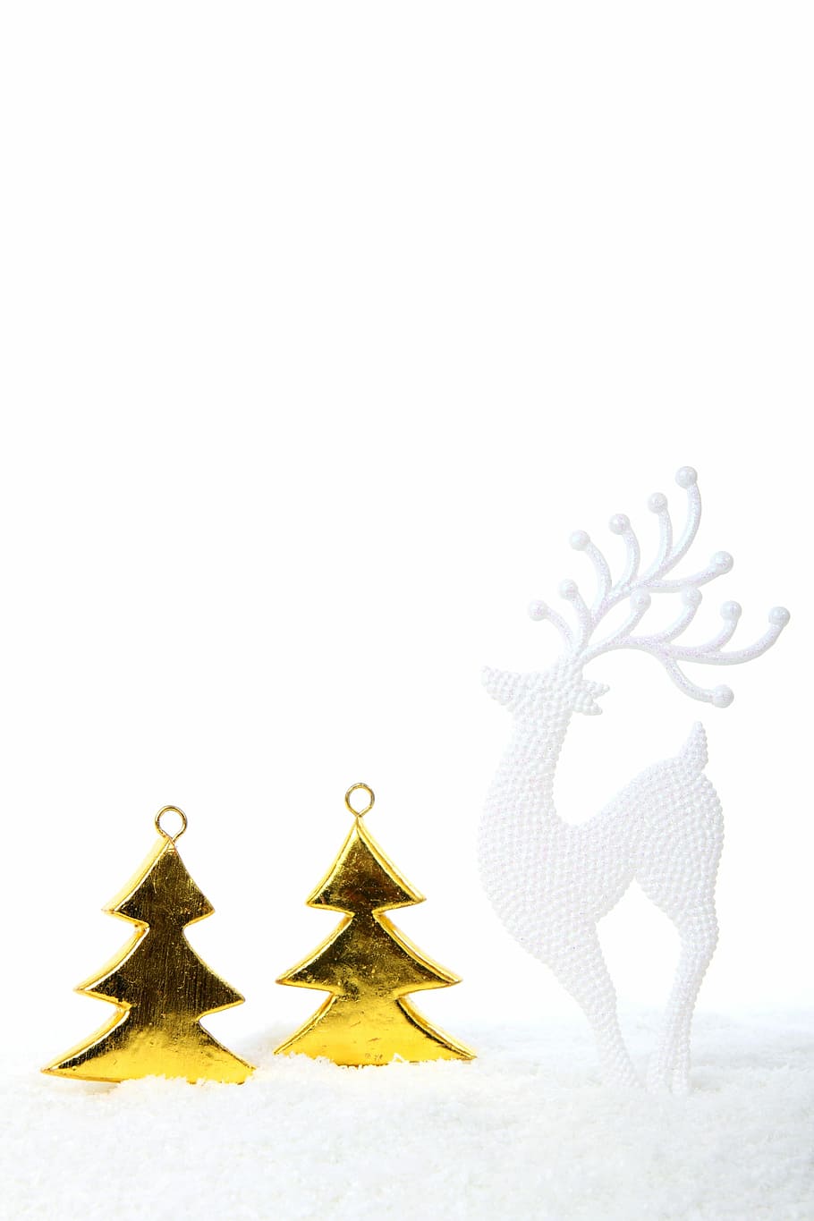 two gold-colored christmas tree figurines beside white deer figurine HD wallpaper