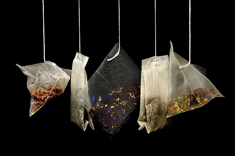 photo of six packs, tea, teabags, black background, macro, kitchen HD wallpaper