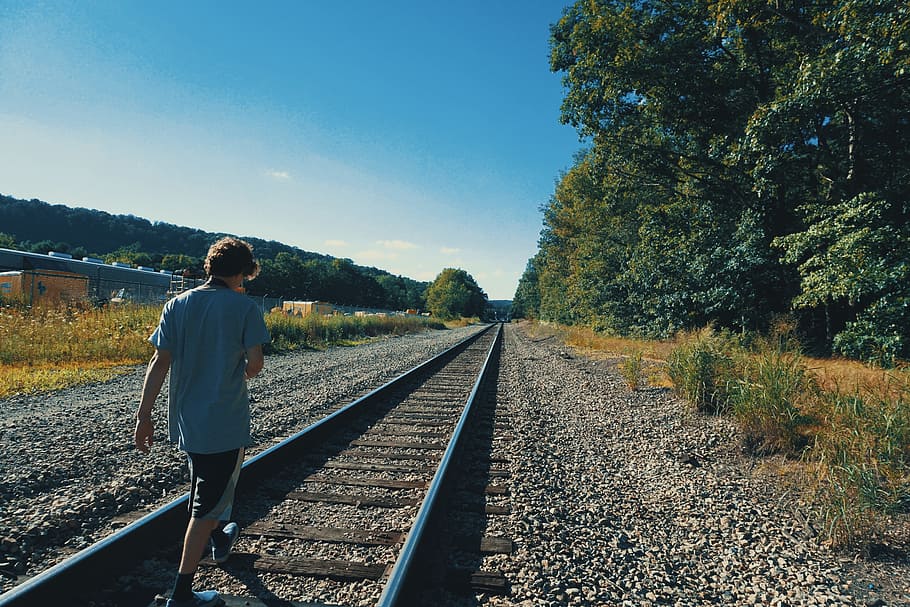 trail, station, train, man, alone, people, rocks, woods, forest HD wallpaper