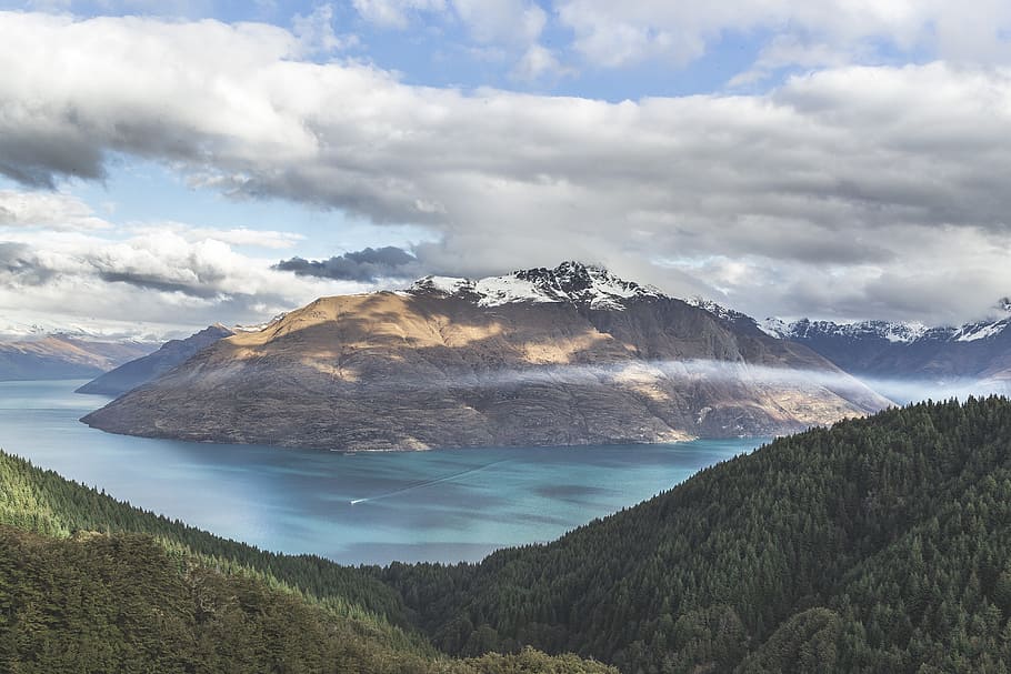brow mountain between body of water during daytime, clouds HD wallpaper