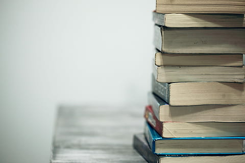assorted books on wooden table, book lot, textbook, used book HD wallpaper