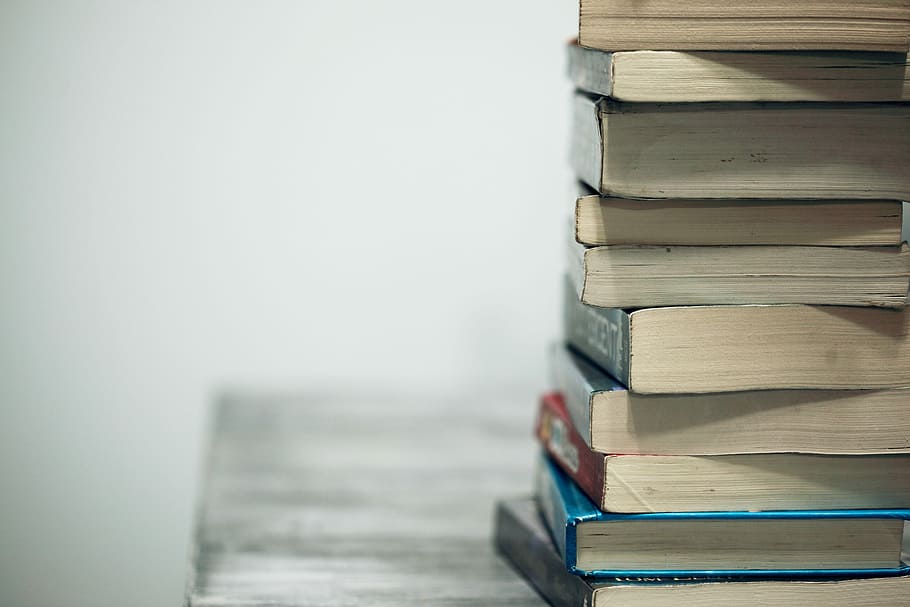 assorted books on wooden table, book lot, textbook, used book HD wallpaper