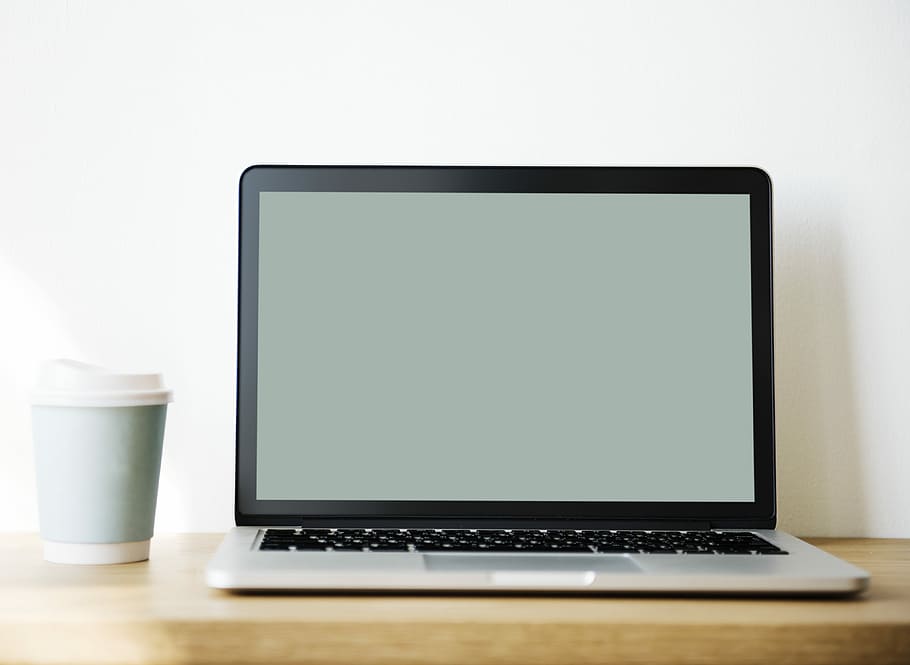 MacBook Pro near teal disposable cup, laptop, computer, desk HD wallpaper