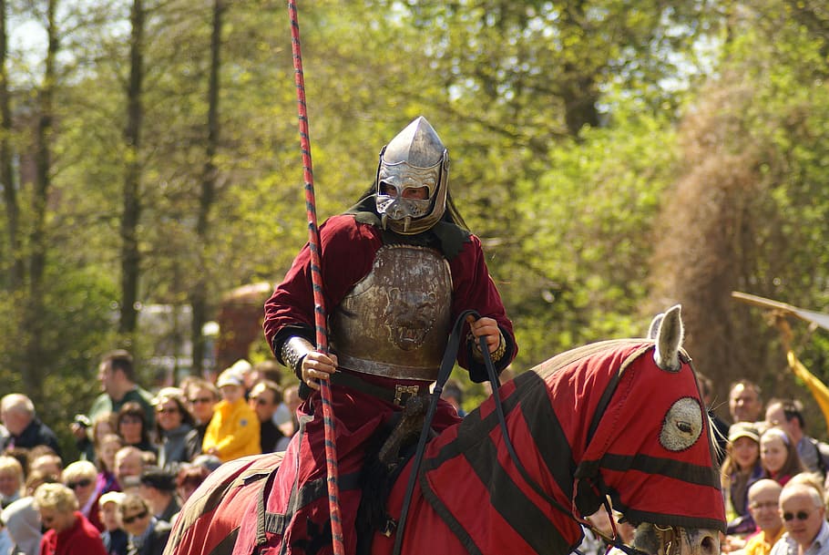 man in red and gray knight suit riding horse in red and black textile HD wallpaper