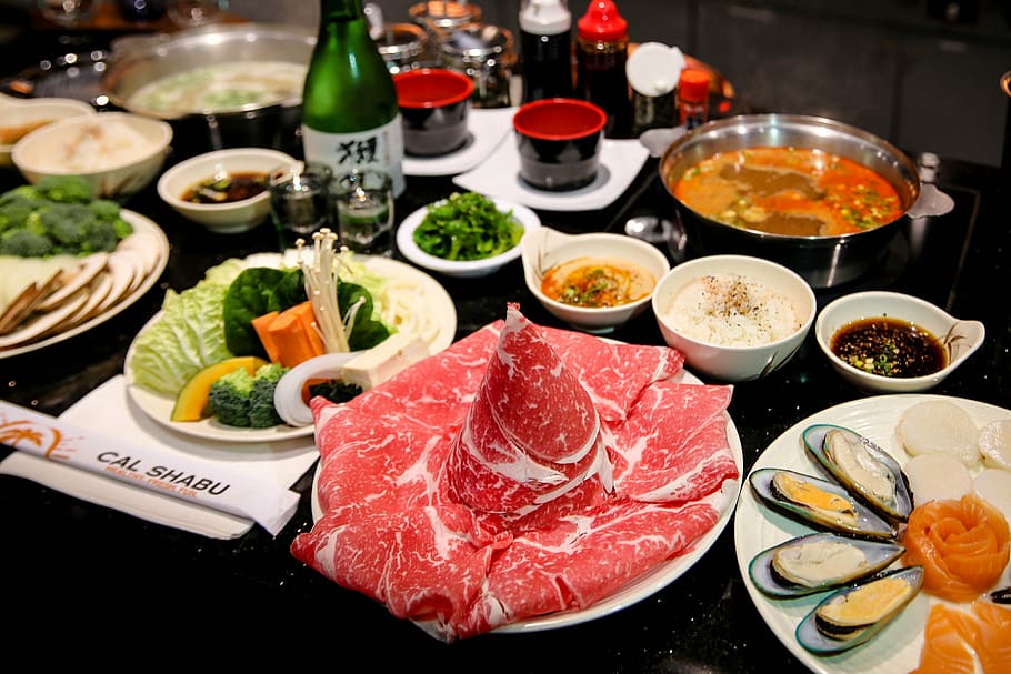 food photography of raw meat and dips, shabu, shabu shabu, japanese