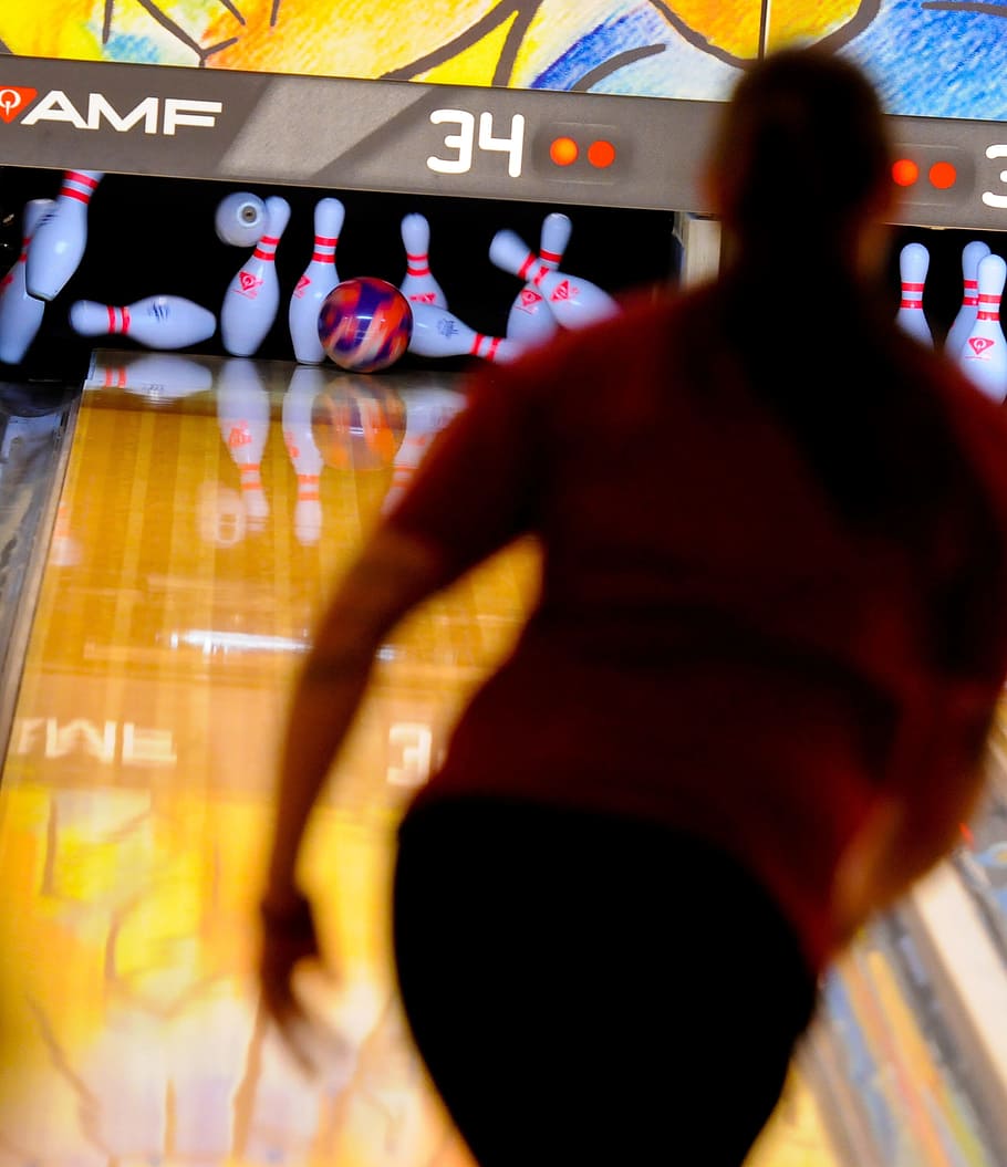 woman paying bowling and hits the bowling pins, Bowler, Ball