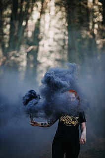 HD wallpaper: woman holding black smoke flare under shade of trees at  daytime | Wallpaper Flare