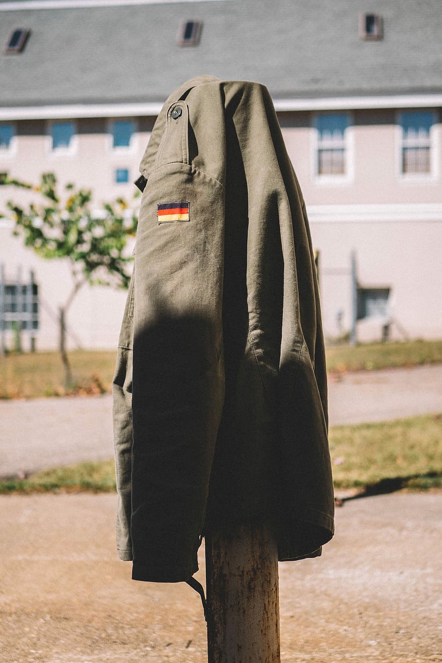 gray button-up jacket on brown rack, brown jacket, coat, army HD wallpaper
