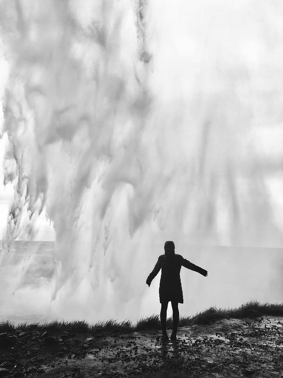 silhouette of person standing near crushing ocean waves, waterfall HD wallpaper