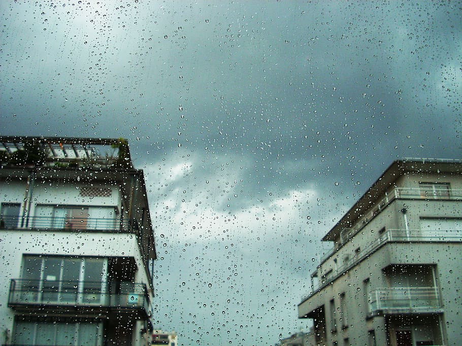 focused photo of glass panel raindrops, white house drenched with rain under gray skies HD wallpaper