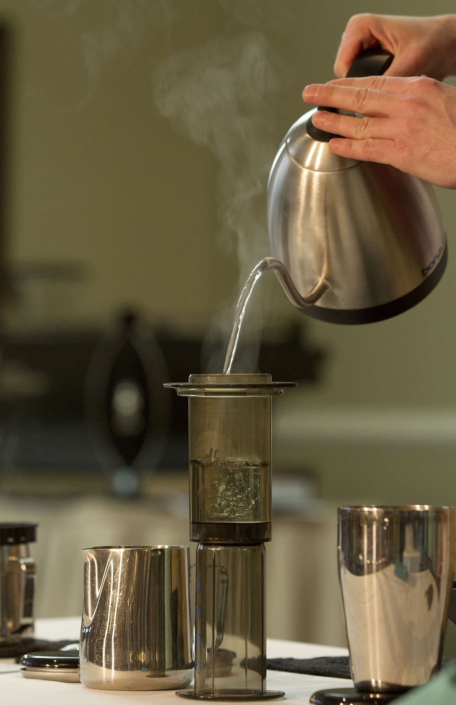 person pouring hot water on gray glass bottle, coffee making HD wallpaper