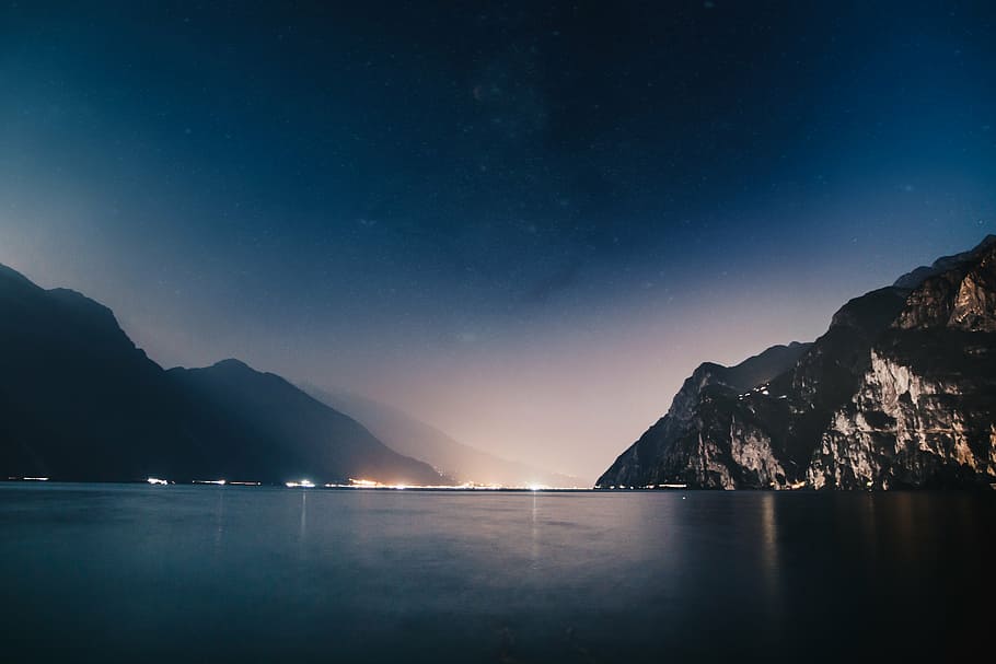 mountain with sea at daytime, ocean, water, wave, nature, night HD wallpaper