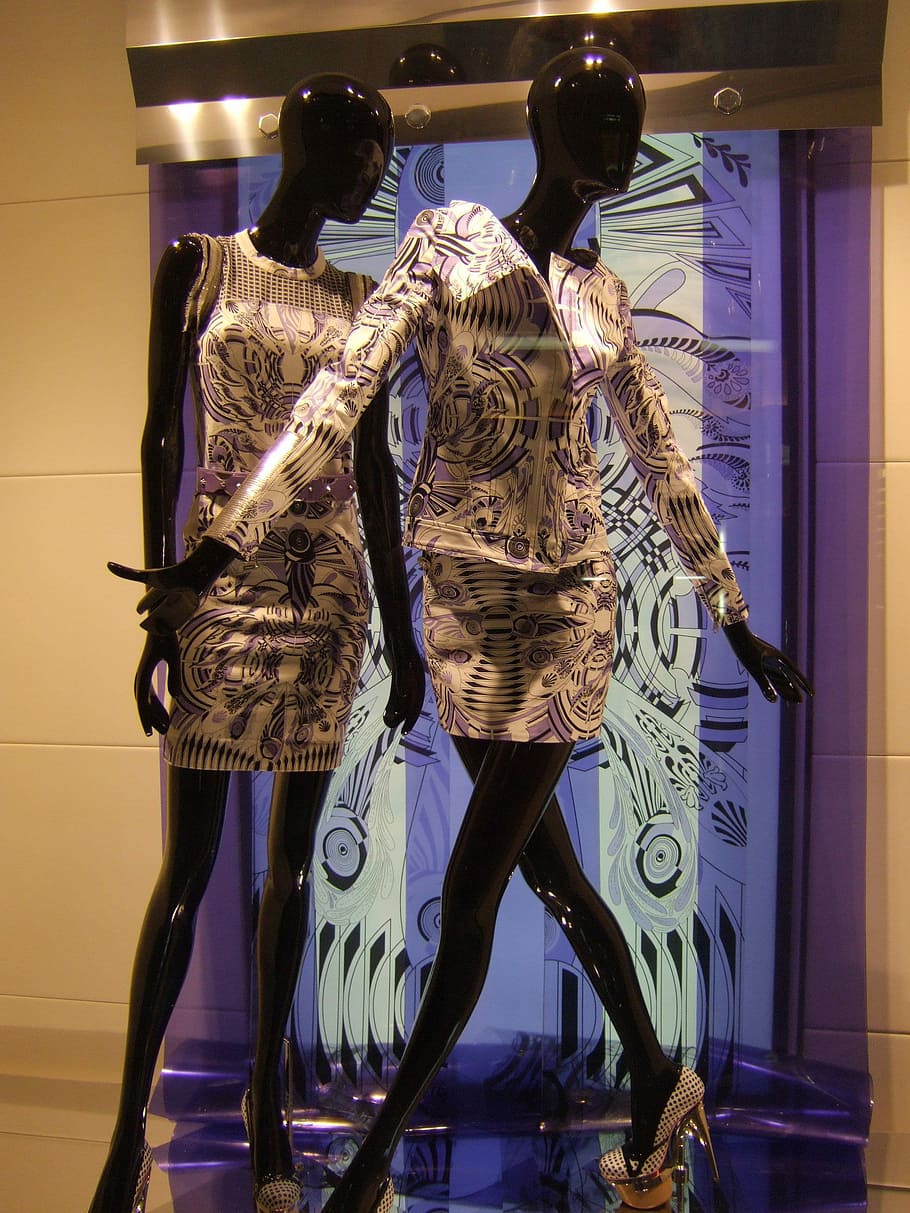 two black mannequins wearing yellow and multicolored long-sleeved shirts HD wallpaper
