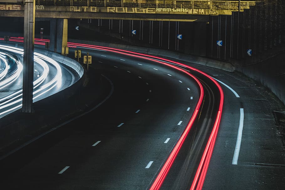 long exposure shot of cars on a road at night, gray asphalt road during nighttime HD wallpaper