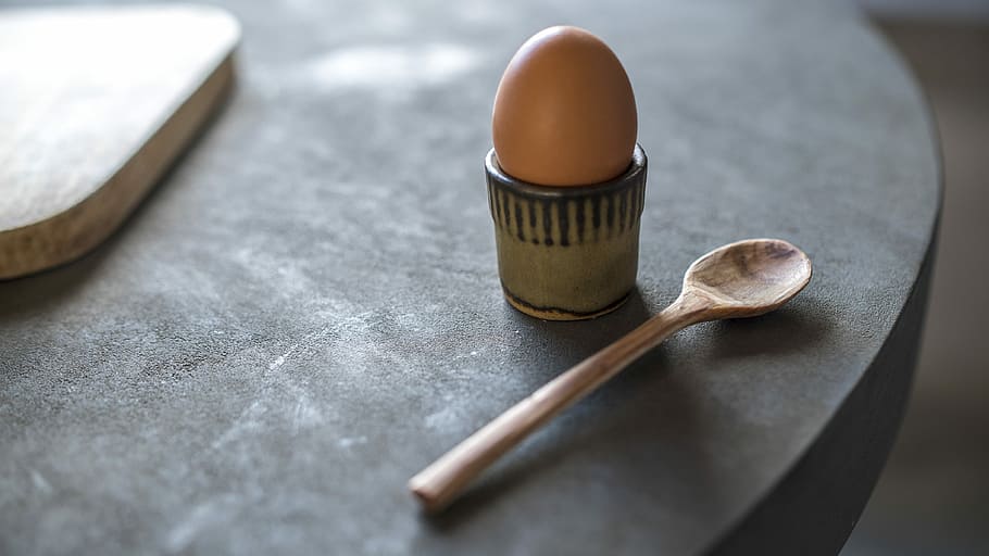 Egg and Spoon on Concrete Table, poultry egg beside brown spoon HD wallpaper